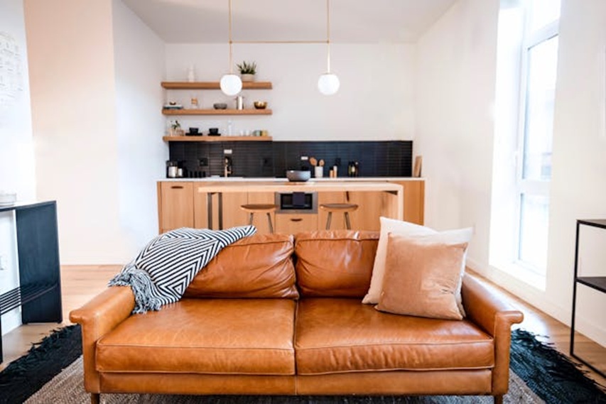 a small living room and kitchen